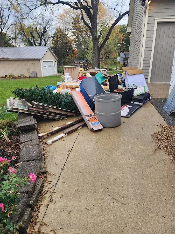 Dumpster being loaded with debris for 3 Yard Dumpster Rental in Goshen